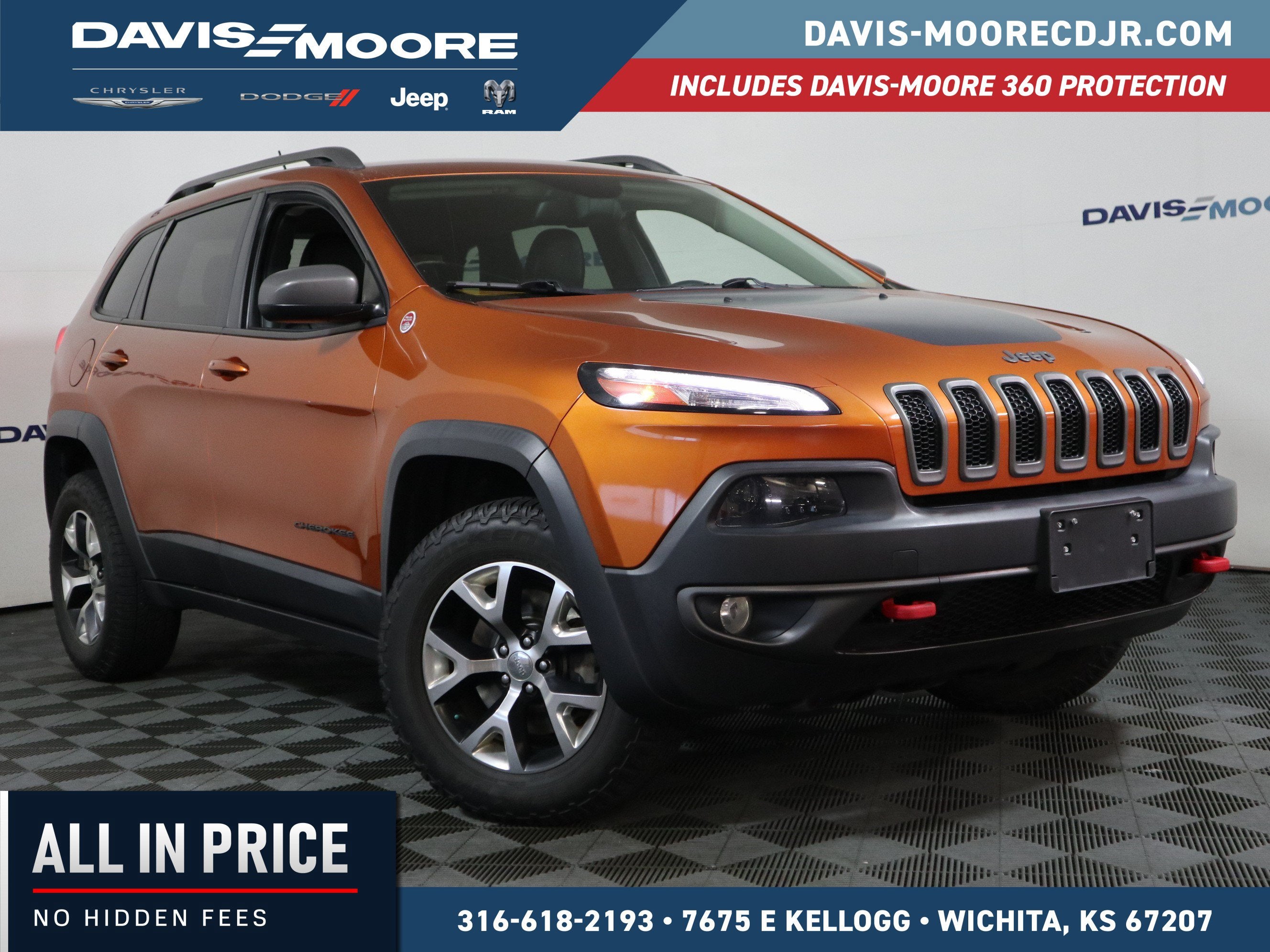 2014 Jeep Cherokee Trailhawk 4WD in Mango Tango Pearlcoat — front three-quarter view